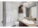 Updated bathroom with granite counters, vanity, and a shower with decorative tiling at 3449 Lorilou Ln # 2, Las Vegas, NV 89121