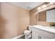 Modern half bathroom with new fixtures, vanity, and decorative mirror at 3449 Lorilou Ln # 2, Las Vegas, NV 89121