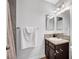 Bathroom featuring a granite countertop and updated lighting fixtures and mirror at 3449 Lorilou Ln # 2, Las Vegas, NV 89121