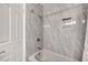 Tiled bathroom with a shower-tub combination and sleek fixtures at 3449 Lorilou Ln # 2, Las Vegas, NV 89121