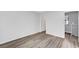 Neutral bedroom with a walk-in closet and connected to the upper level via staircase at 3449 Lorilou Ln # 2, Las Vegas, NV 89121