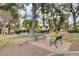 Relaxing common area with park benches and walking paths, shaded by mature trees and landscaping at 3449 Lorilou Ln # 2, Las Vegas, NV 89121