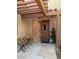 Charming brick-accented front entrance featuring a wooden pergola and outdoor seating area at 3449 Lorilou Ln # 2, Las Vegas, NV 89121