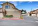 View of the front of the home with driveway, garage and manicured shrubs at 3449 Lorilou Ln # 2, Las Vegas, NV 89121