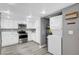 Well-equipped kitchen featuring modern appliances, ample storage, and a convenient laundry area at 3449 Lorilou Ln # 2, Las Vegas, NV 89121