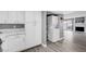 Convenient kitchen laundry area with ample cabinet space and seamless access to the living area at 3449 Lorilou Ln # 2, Las Vegas, NV 89121