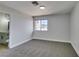 Comfortable bedroom with neutral carpeting, freshly painted walls, and an adjacent updated bathroom at 3484 Nightflower Ln # B, Las Vegas, NV 89121