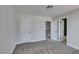 This bedroom features neutral walls, carpeted floors, and includes access to an ensuite bathroom at 3484 Nightflower Ln # B, Las Vegas, NV 89121