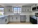 Beautiful updated kitchen with stainless steel appliances, quartz countertops, and modern finishes at 3484 Nightflower Ln # B, Las Vegas, NV 89121