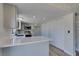 Bright kitchen features modern appliances, light countertops, and ample storage space at 3484 Nightflower Ln # B, Las Vegas, NV 89121