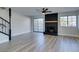 Contemporary living room featuring a fireplace, staircase, and ample natural light at 3484 Nightflower Ln # B, Las Vegas, NV 89121