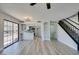Open-concept living space with tiled floors, a kitchen, and large sliding doors at 3484 Nightflower Ln # B, Las Vegas, NV 89121