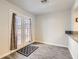 Light-filled dining room with French doors, gray floors, and counterspace, with a neutral rug at 3609 Laguna Del Sol Dr, Las Vegas, NV 89121