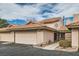 Charming townhome featuring a terracotta roof, two-car garage and low-maintenance desert landscaping at 3609 Laguna Del Sol Dr, Las Vegas, NV 89121