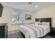 Cozy bedroom featuring a patterned bedspread, dark wood furniture, and a window at 3665 Bronco Rd, Las Vegas, NV 89103