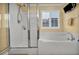 Bathroom features a tub, a shower with glass door, and ample natural light at 3724 Thomas Patrick Ave, North Las Vegas, NV 89032