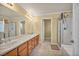 Bright bathroom features double sinks, a large mirror, and a separate shower at 3724 Thomas Patrick Ave, North Las Vegas, NV 89032