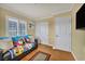 Inviting bedroom boasts two bright windows, wood floors, closet, and a clean neutral palette at 3724 Thomas Patrick Ave, North Las Vegas, NV 89032