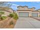 Charming two-story townhome featuring an attached two-car garage and low-maintenance landscaping at 3724 Thomas Patrick Ave, North Las Vegas, NV 89032