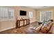 Comfortable living room featuring tile floors, a couch, and plenty of natural light at 3724 Thomas Patrick Ave, North Las Vegas, NV 89032