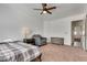 Cozy bedroom offers a comfortable bed, ceiling fan, and an easy chair at 3924 Diamond Ridge St, Las Vegas, NV 89129