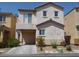 Two story home with an attached garage and a balcony on the second level at 4042 Morning Peace St, Las Vegas, NV 89115