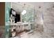 Elegant bathroom featuring marble finishes, a glass shower, and modern fixtures at 4381 W Flamingo Rd # 2322/2320, Las Vegas, NV 89103