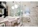 Luxurious bathroom with double sinks, a glass shower, and high-end finishes at 4381 W Flamingo Rd # 2322/2320, Las Vegas, NV 89103