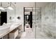 Elegant bathroom offers marble throughout, glass enclosed shower, and a luxurious double vanity at 4381 W Flamingo Rd # 2322/2320, Las Vegas, NV 89103