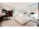 Contemporary bedroom featuring a king bed, mirrored wall, and kitchenette at 4381 W Flamingo Rd # 2322/2320, Las Vegas, NV 89103