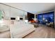 Well-lit bedroom featuring a king bed and a seating area with city views at 4381 W Flamingo Rd # 2322/2320, Las Vegas, NV 89103