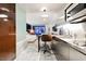 Sleek modern kitchen with stainless steel appliances and a view into the living area at 4381 W Flamingo Rd # 2322/2320, Las Vegas, NV 89103
