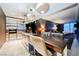 Modern kitchen featuring stainless steel appliances, an island with seating, and adjacent living area at 4381 W Flamingo Rd # 2322/2320, Las Vegas, NV 89103