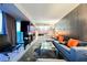 Open-concept living room showcasing modern furniture, a sleek fireplace, and views of the city at 4381 W Flamingo Rd # 2322/2320, Las Vegas, NV 89103
