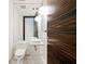 Contemporary bathroom with unique wood-grain door, vessel sink, and modern fixtures at 4381 W Flamingo Rd # 5708, Las Vegas, NV 89103