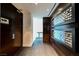 Elegant hallway with dark wood accents and unique decorative wall art at 4381 W Flamingo Rd # 5708, Las Vegas, NV 89103