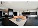Modern living room features a leather sofa, sleek design, and panoramic city views through floor-to-ceiling windows at 4381 W Flamingo Rd # 5708, Las Vegas, NV 89103