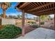 Relaxing backyard with a covered patio, desert landscaping, and a rock pathway at 4442 Bunker Cir, Las Vegas, NV 89121