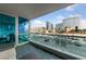 A condo balcony boasts city views and a relaxed seating area with views of Las Vegas at 4525 Dean Martin Dr # 607, Las Vegas, NV 89103