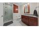 Bathroom boasts marble floors, walk-in shower, and wooden cabinetry at 4525 Dean Martin Dr # 607, Las Vegas, NV 89103