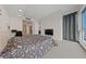 Bright bedroom with skyline view, neutral decor, and carpeted floors at 4525 Dean Martin Dr # 607, Las Vegas, NV 89103