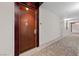 Well lit building hallway features neutral decor and carpeted floors at 4525 Dean Martin Dr # 607, Las Vegas, NV 89103