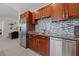 Open-concept kitchen with stainless steel fridge and ample storage at 4525 Dean Martin Dr # 607, Las Vegas, NV 89103