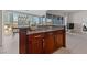 Kitchen island offering seating, granite counters, and city views at 4525 Dean Martin Dr # 607, Las Vegas, NV 89103