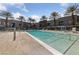 Beautiful community pool with palm trees and seating at 4525 Dean Martin Dr # 607, Las Vegas, NV 89103