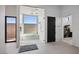 Bright bathroom featuring a glass-enclosed shower with a built-in bench and natural light at 500 Trenier Dr, Henderson, NV 89002