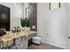 Stylish bathroom boasts a unique marble countertop and sleek, modern fixtures at 500 Trenier Dr, Henderson, NV 89002