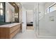 Elegant bathroom with a long vanity, glass shower, and modern tile accents at 500 Trenier Dr, Henderson, NV 89002