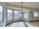 Bright dining room with modern light fixture and large windows offering natural light at 523 Coolidge Ave, Henderson, NV 89015