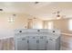 Spacious kitchen island with seating and storage, open to the main living area at 5282 Panguitch Dr, Las Vegas, NV 89122